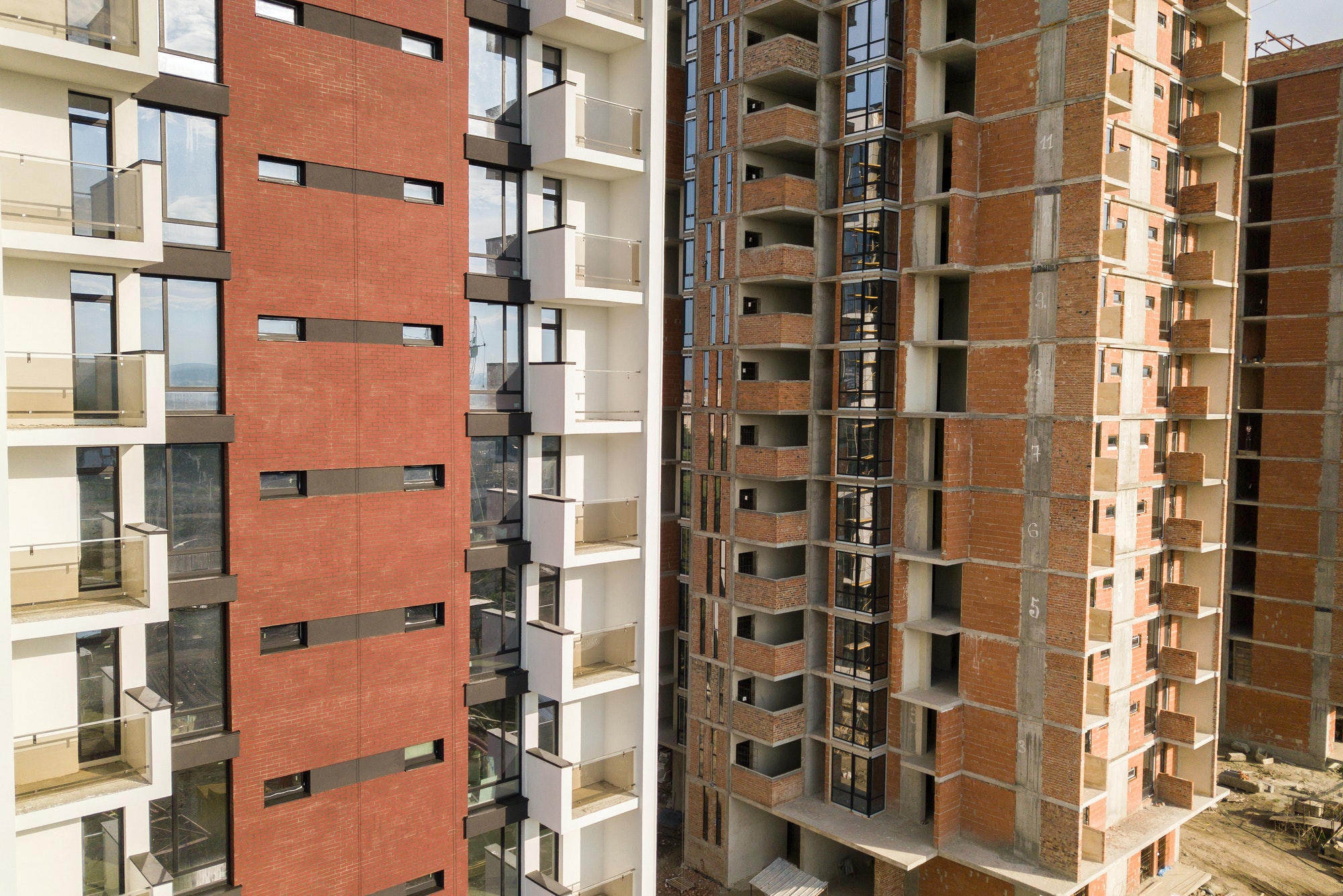 High residential apartment buildings under construction. Real estate development
